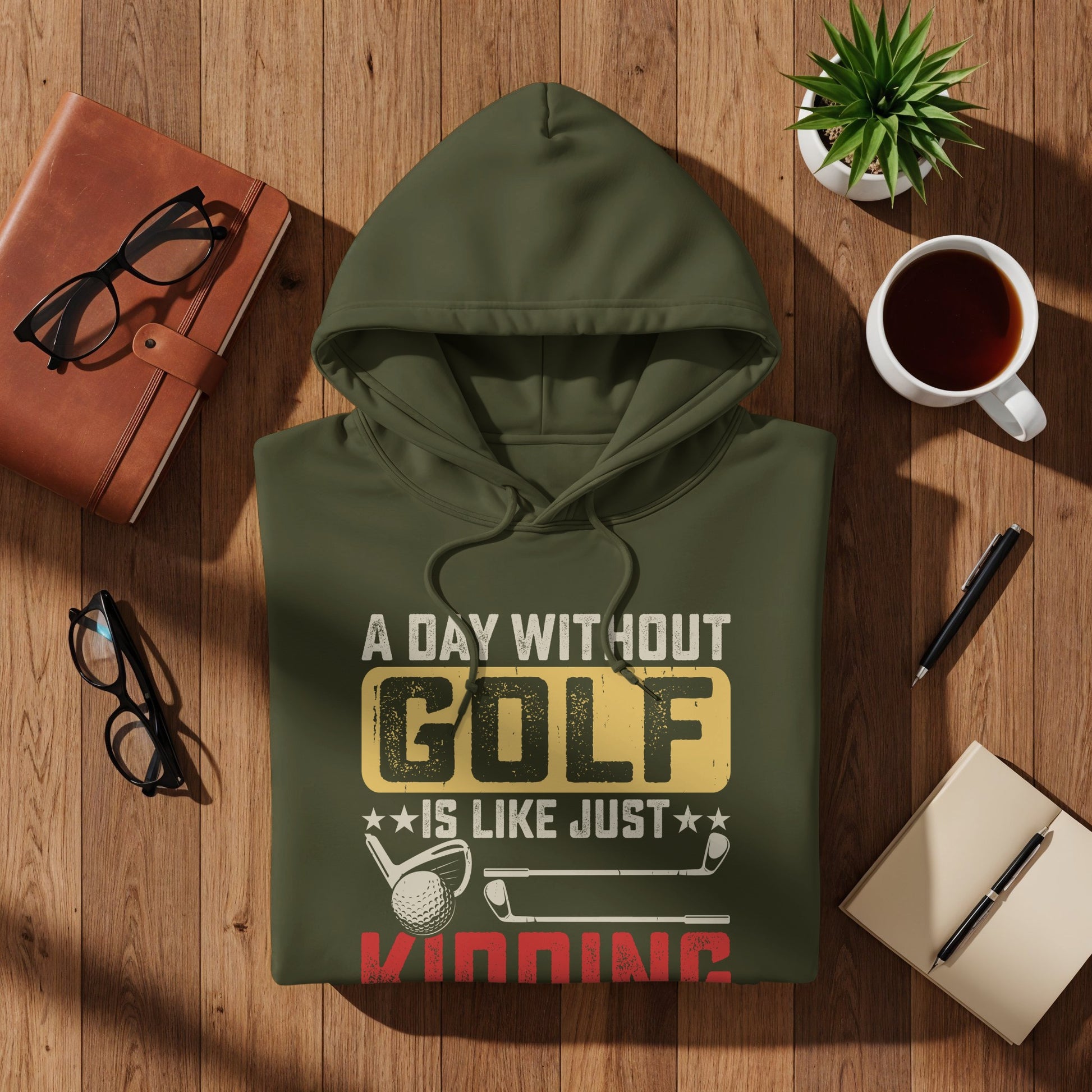 Olive green hooded sweatshirt with "A Day Without Golf Is Like Just Kidding" text and golf graphics.