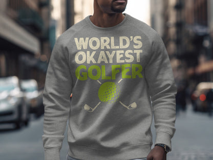 Gray sweatshirt with "World's Okayest Golfer" text and golf ball and clubs graphic.