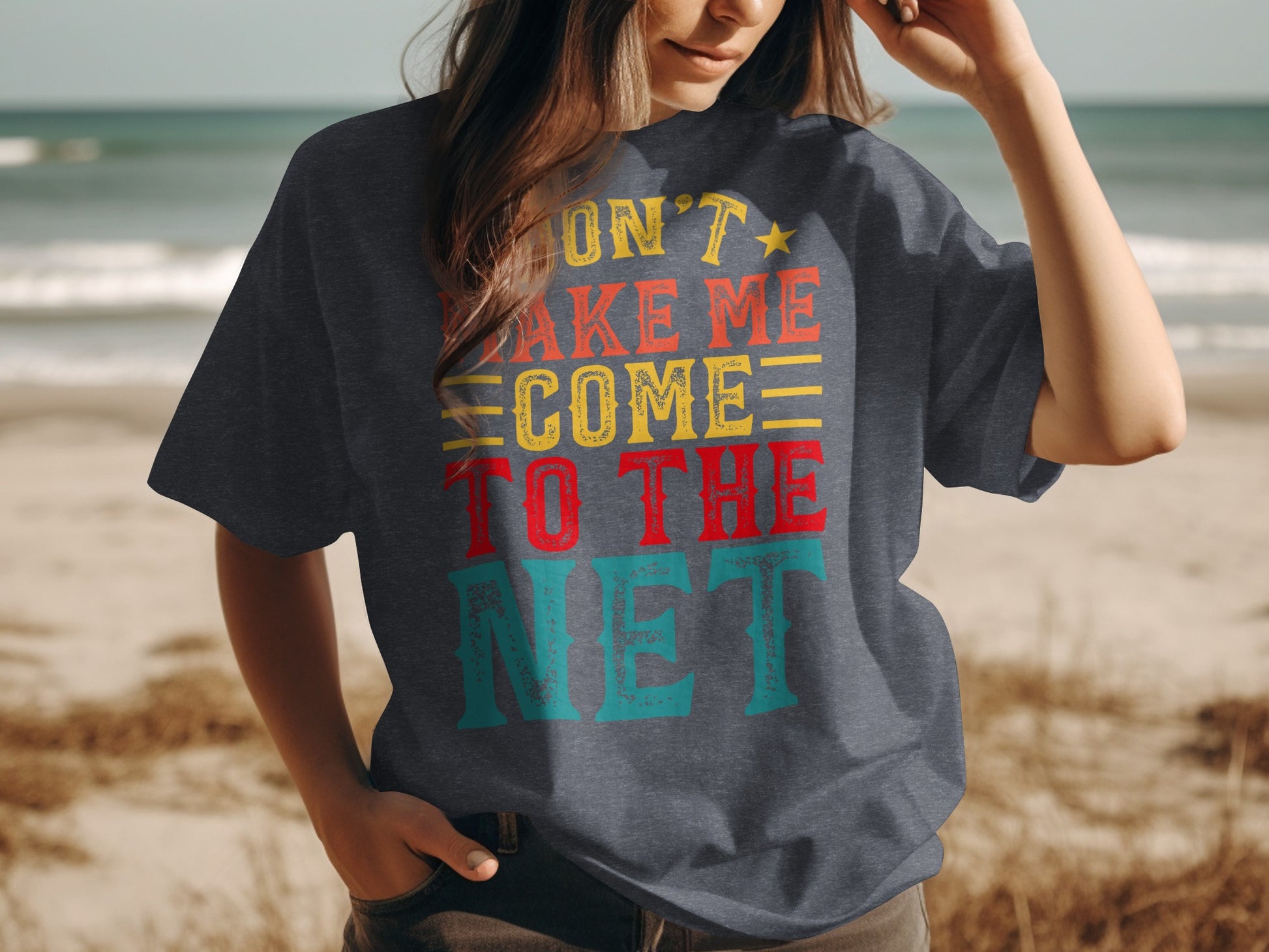 T-shirt with "Don't make me come to the net" text in colorful retro font.