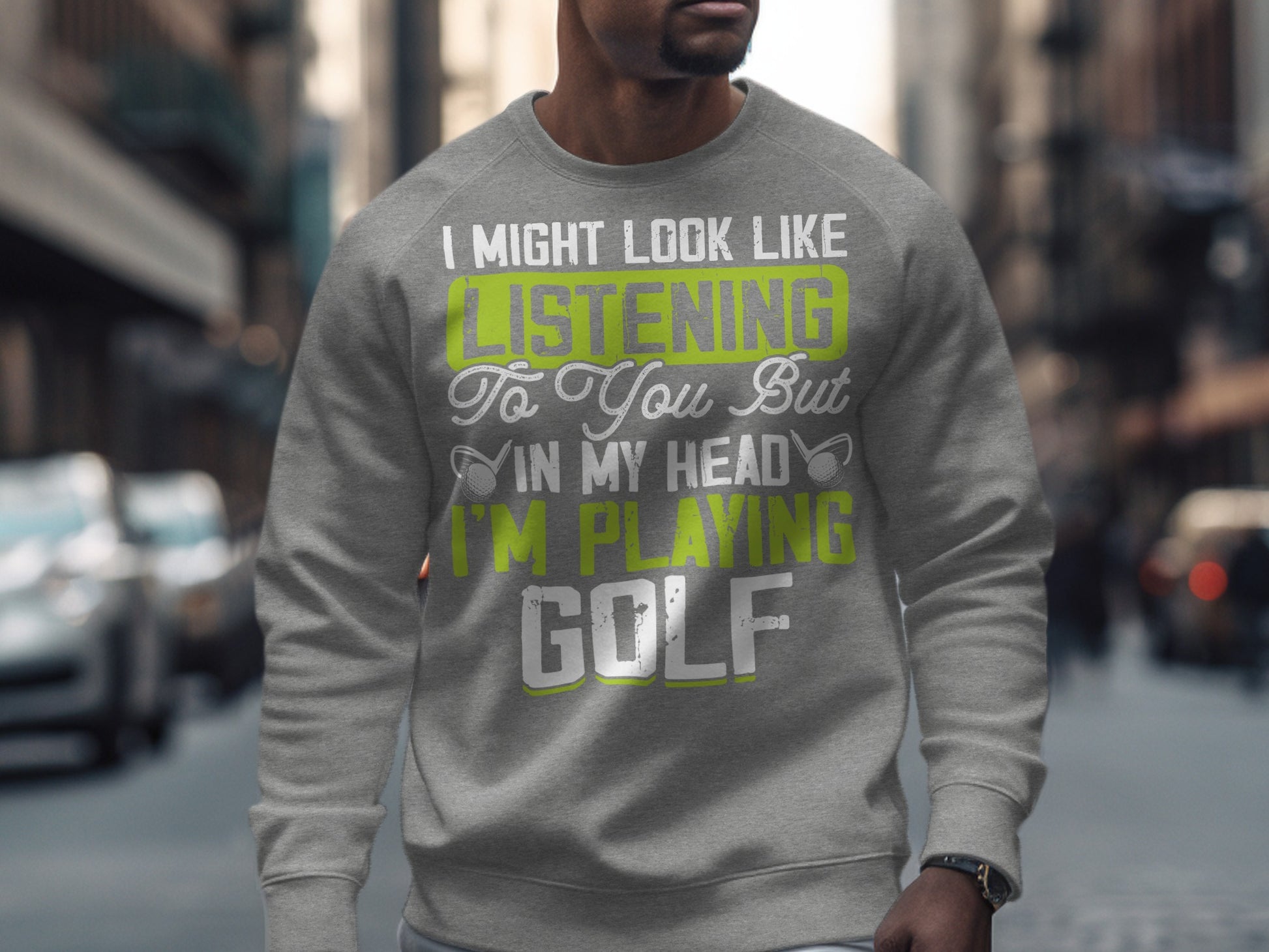 Grey sweatshirt with "I Might Look Like Listening... In My Head I'm Playing GOLF" text.