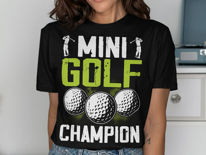 Black t-shirt with "MINI GOLF CHAMPION" text and three golf balls.