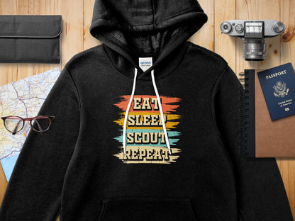 Black hoodie with "Eat Sleep Scout Repeat" graphic.