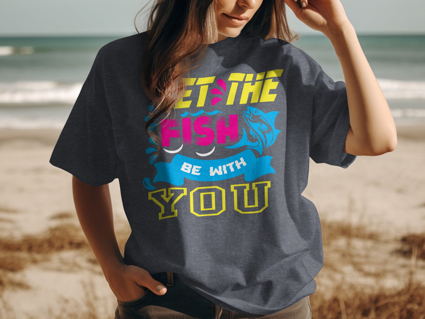 Dark t-shirt with "Let the fish be with you" text and fish graphic.