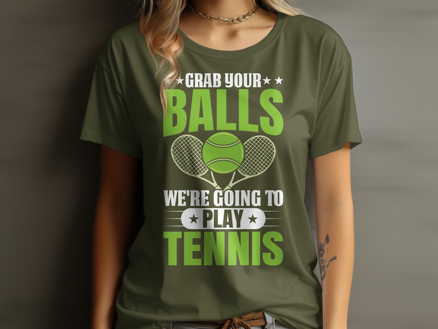 Green t-shirt with text "GRAB YOUR BALLS WE'RE GOING TO PLAY TENNIS" and tennis graphics.