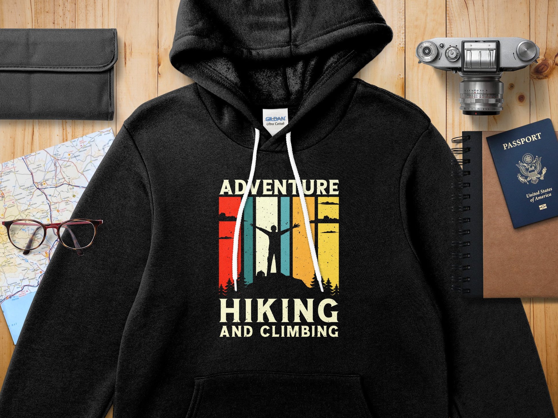 Black Gildan hoodie with "Adventure Hiking and Climbing" graphic.