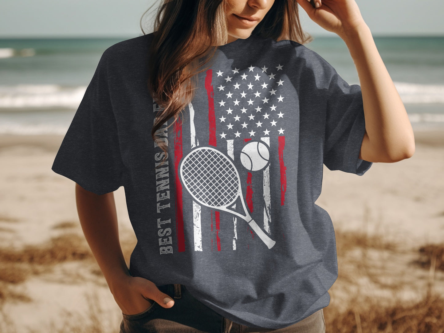Dark gray t-shirt with American flag and tennis racket and ball graphic.