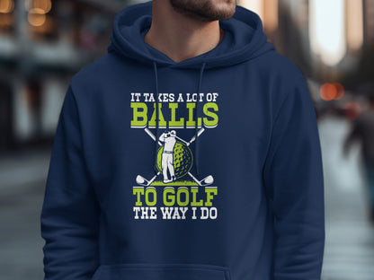 Navy hoodie with graphic: "It takes a lot of balls to golf the way I do."