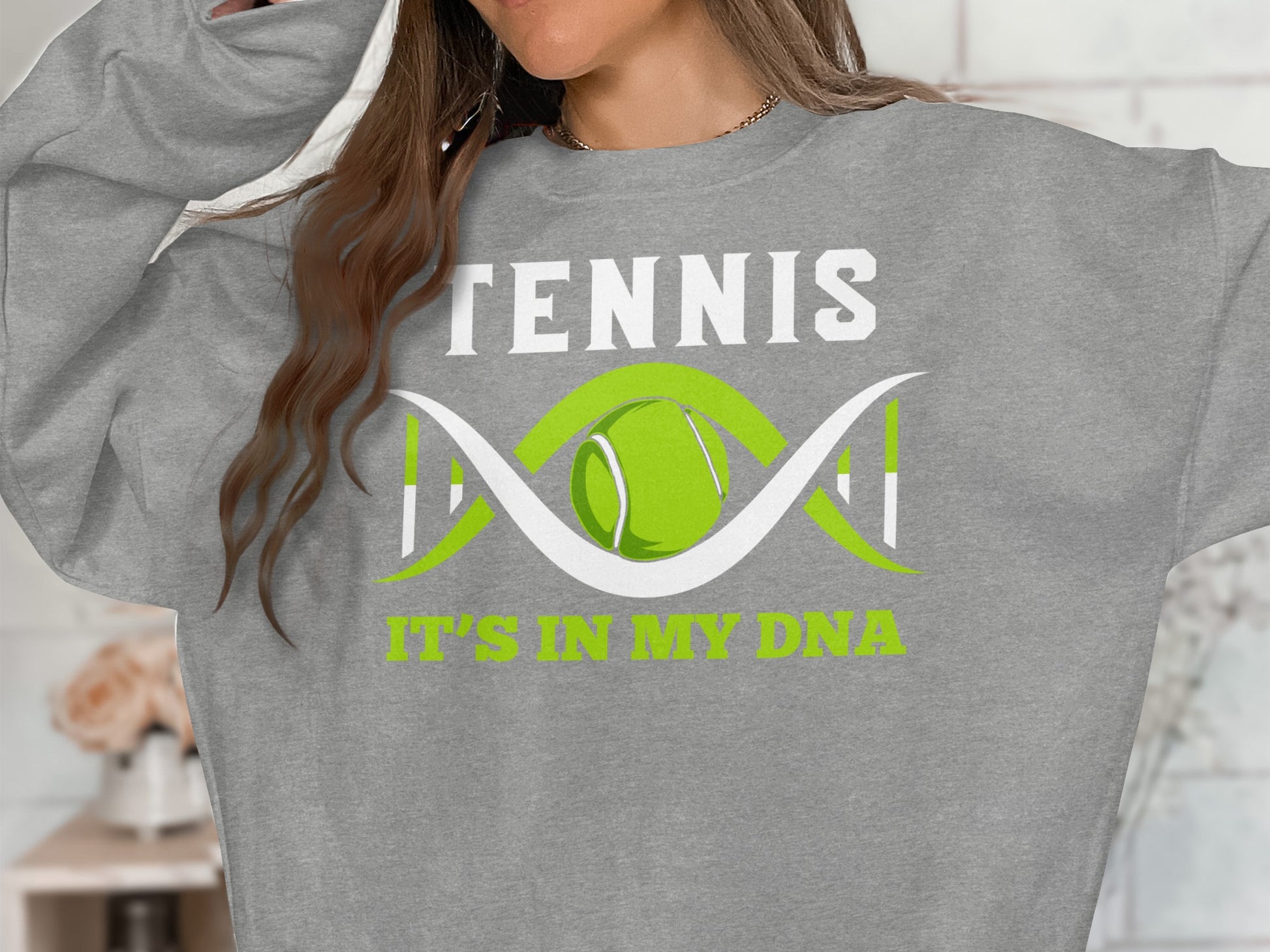 Gray sweatshirt with "TENNIS IT'S IN MY DNA" and a tennis ball within a DNA strand.