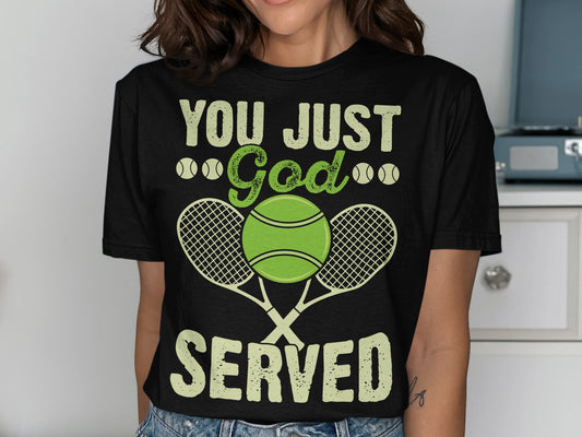Black t-shirt with "YOU JUST God SERVED" text and tennis rackets and balls.