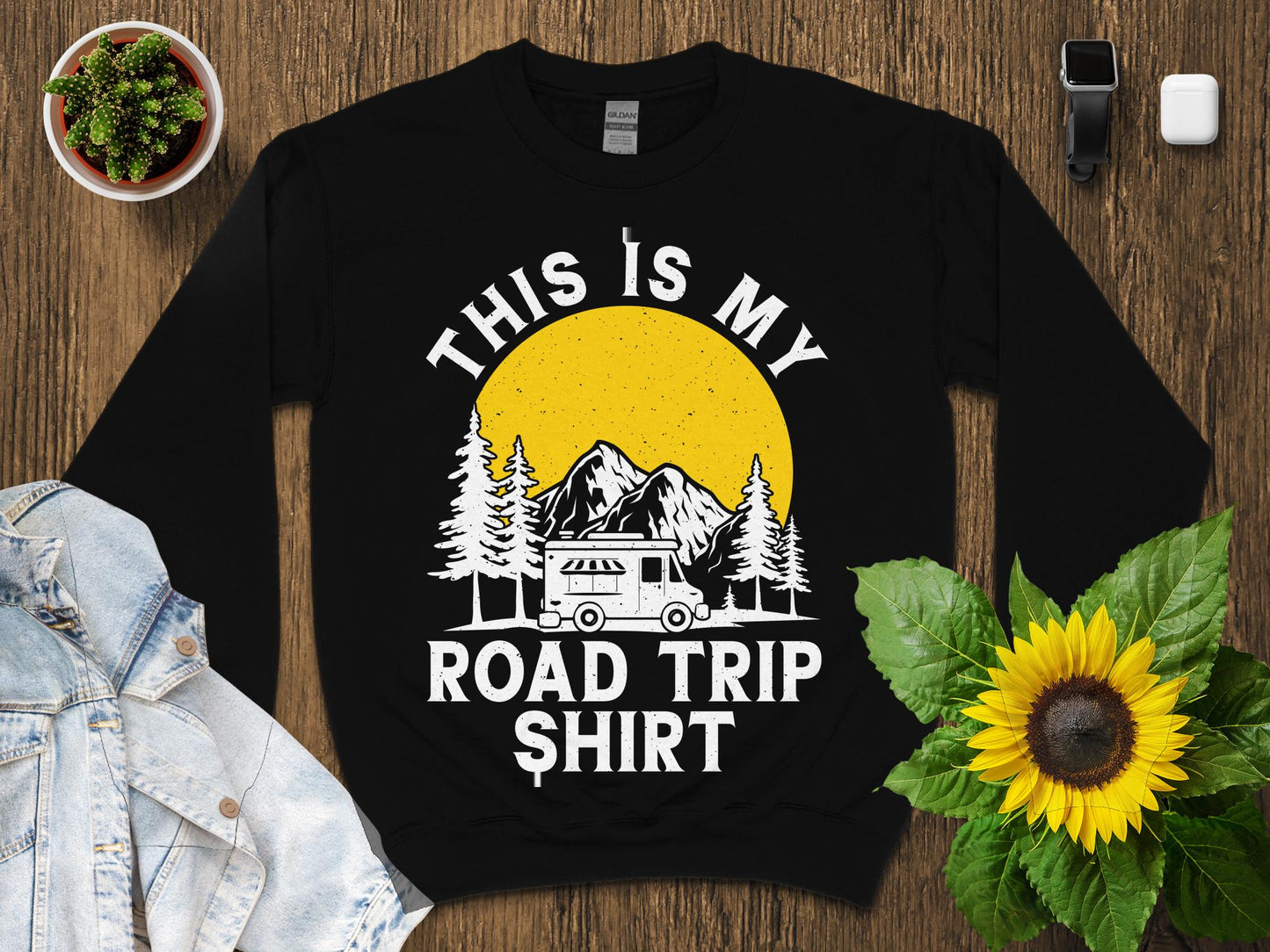 Black sweatshirt with "This is my road trip shirt" graphic featuring a camper and sun.
