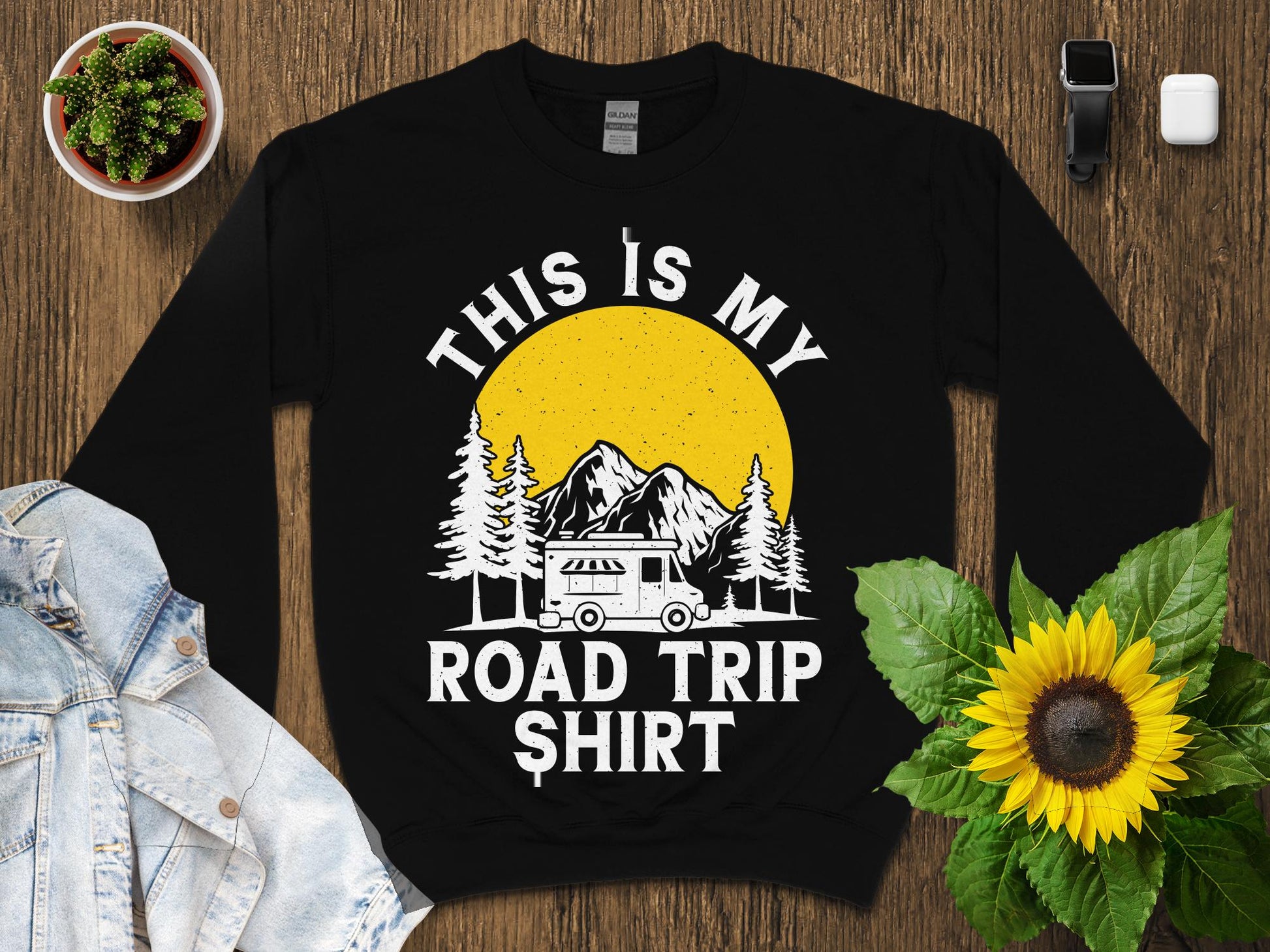 Black sweatshirt with "This is my road trip shirt" graphic featuring a camper and sun.