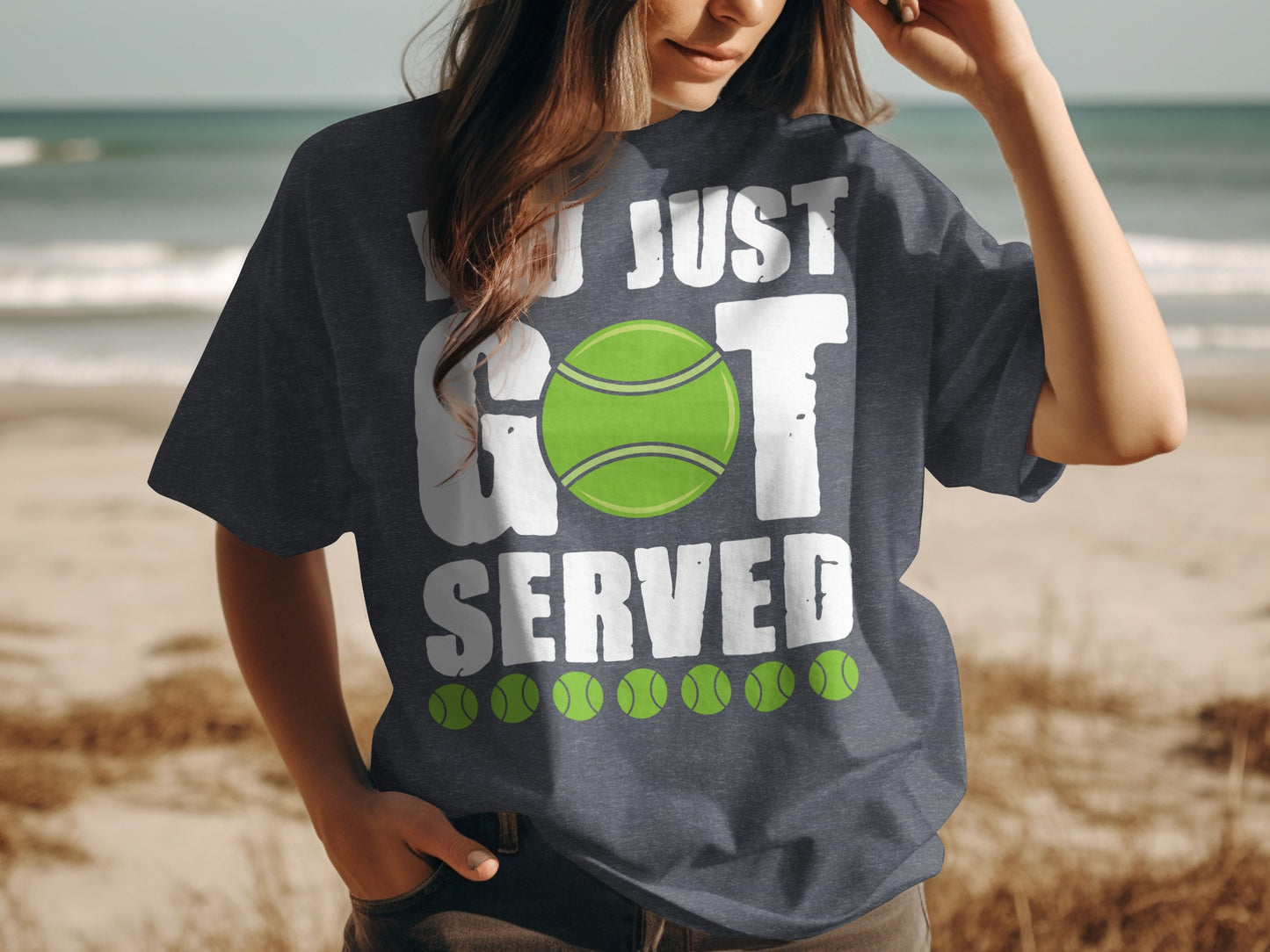 Dark t-shirt with white text "YOU JUST GOT SERVED" and a tennis ball graphic.
