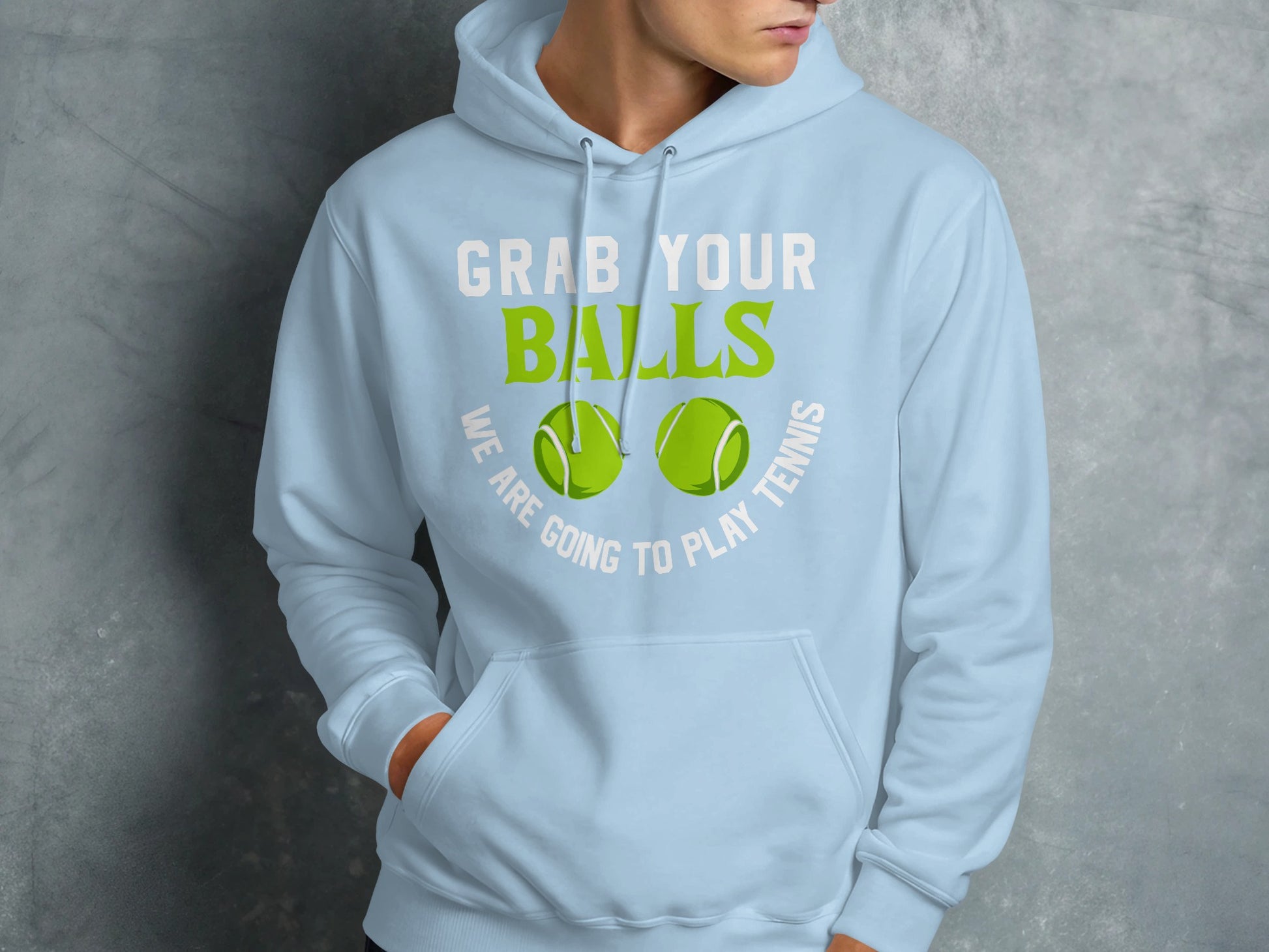 Light blue hoodie with green text "GRAB YOUR BALLS" and "WE ARE GOING TO PLAY TENNIS".