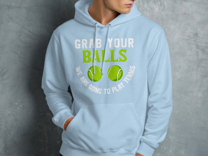 Light blue hoodie with green text "GRAB YOUR BALLS" and "WE ARE GOING TO PLAY TENNIS".