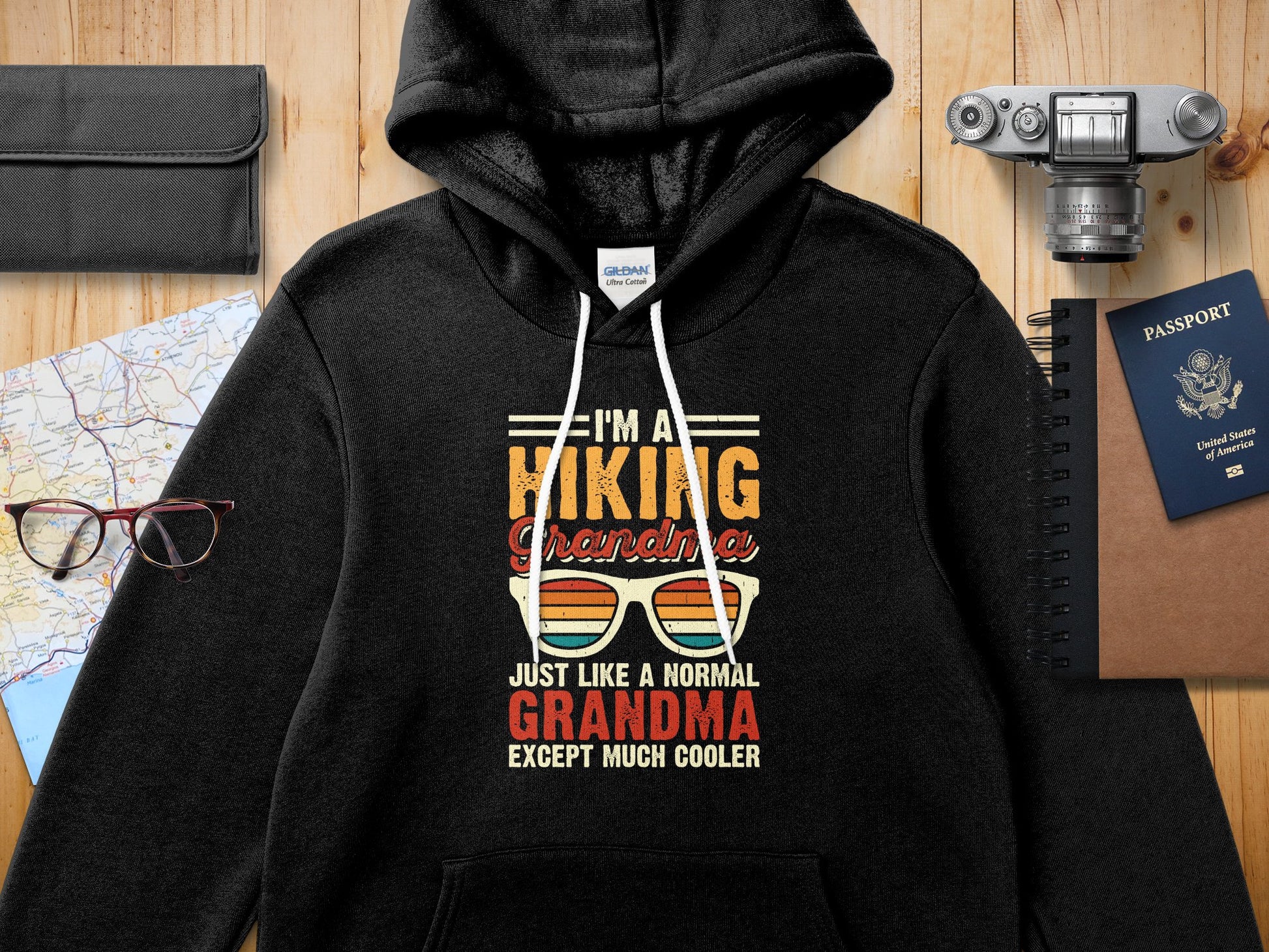 Black hoodie with "I'm a hiking Grandma except much cooler" graphic.