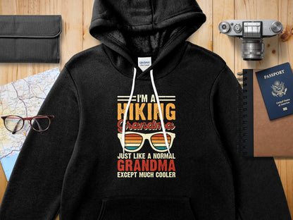 Black hoodie with "I'm a hiking Grandma except much cooler" graphic.