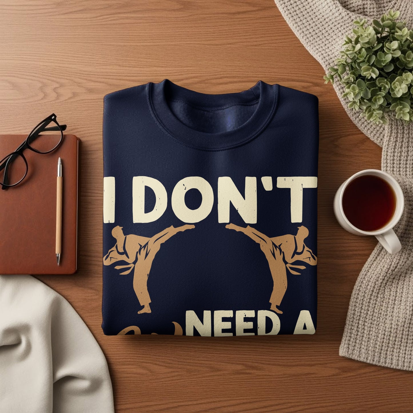 Navy sweatshirt with "I DON'T NEED A" and karate figures.