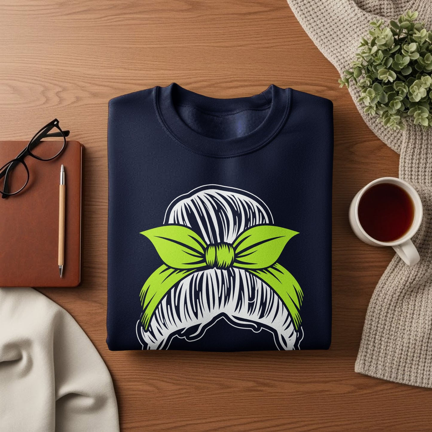 Navy blue sweatshirt with lime green messy bun graphic.