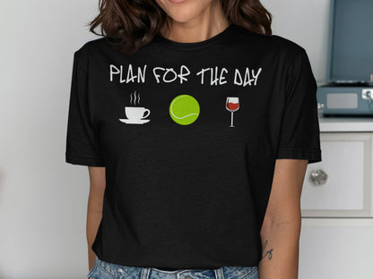 T-shirt with icons: coffee cup, tennis ball, wine glass, and text "plan for the day."
