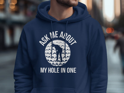 Navy hoodie with white text and golf ball graphic: "Ask Me About My Hole In One"