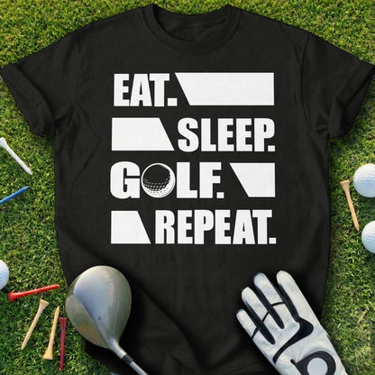 Black t-shirt with "Eat. Sleep. Golf. Repeat." text, golf club, glove, and balls.
