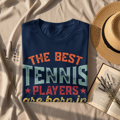 Navy t-shirt with "The Best Tennis Players are Born In" slogan.