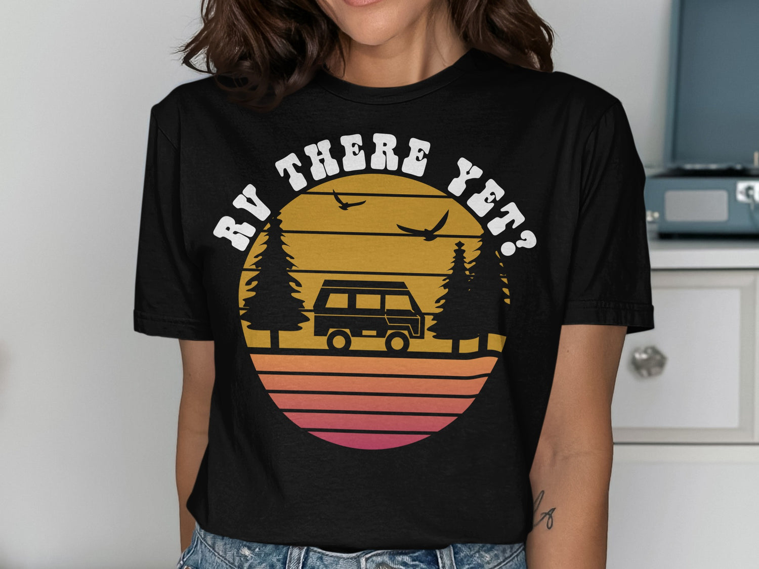 Sunset graphic with RV, trees, and birds, text "RV THERE YET?".