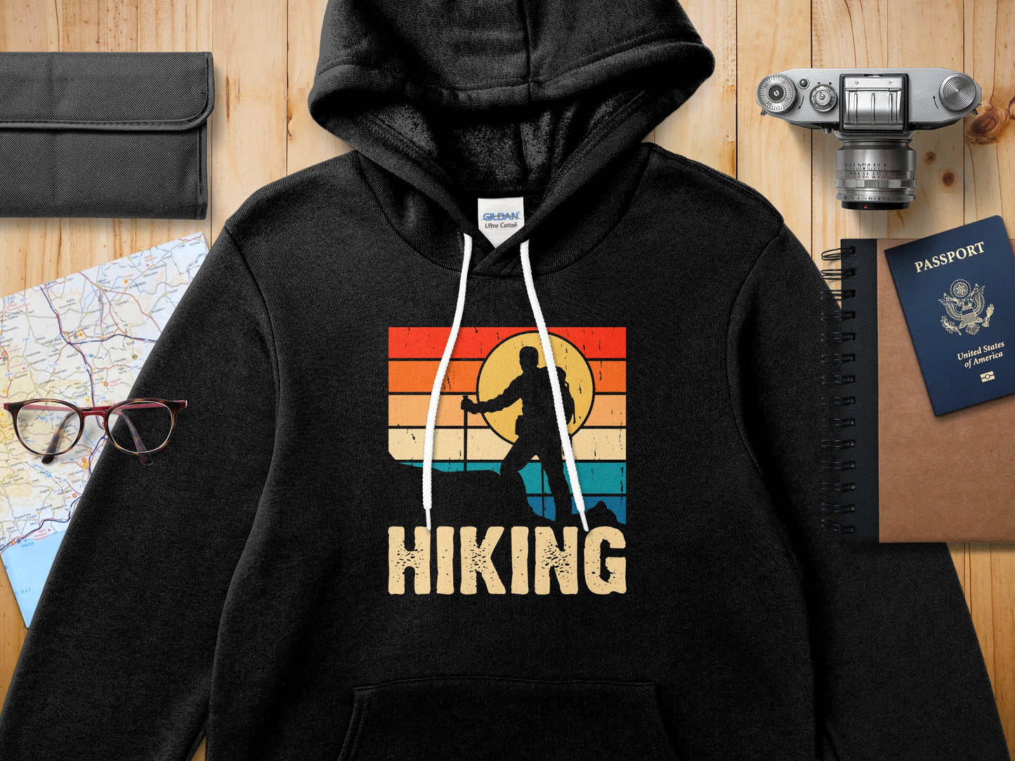 Black hoodie with "Hiking" text and mountain sunset graphic.