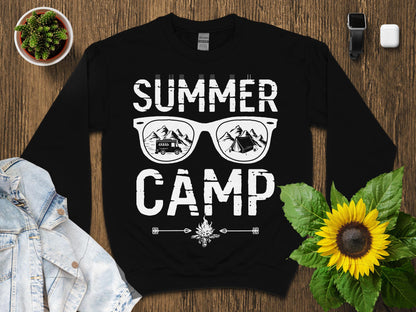 Black sweatshirt with "SUMMER CAMP" text and sunglasses graphic.