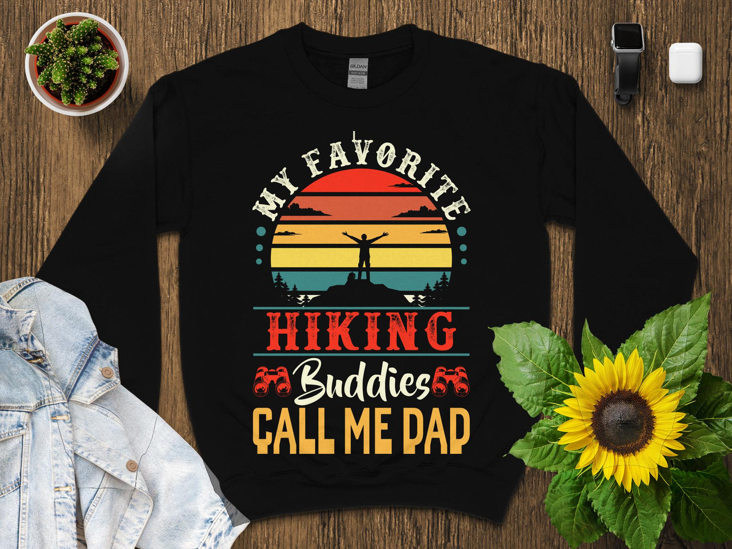 Black t-shirt with sunset and "My Favorite Hiking Buddies Call Me Dad" text.