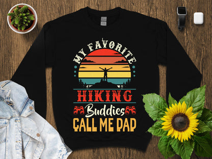 Black t-shirt with sunset and "My Favorite Hiking Buddies Call Me Dad" text.