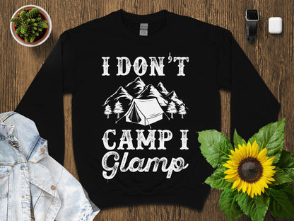 Black sweatshirt with "I don't camp I glamp" text and mountain graphic.