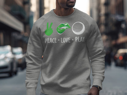 Gray sweatshirt with peace sign, lips, and golf ball icons and "PEACE LOVE PLAY".