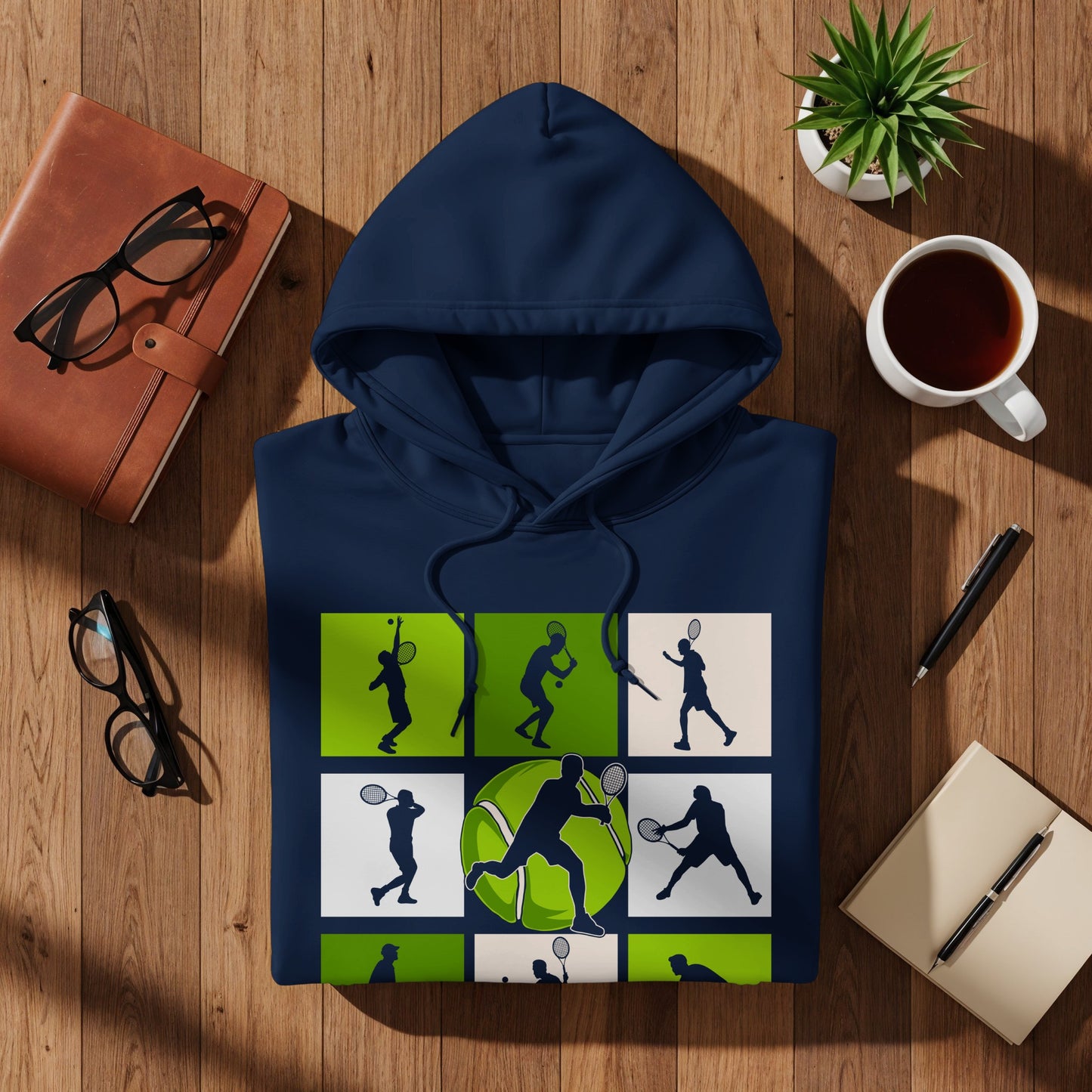 Navy hoodie with tennis player graphic and green squares.