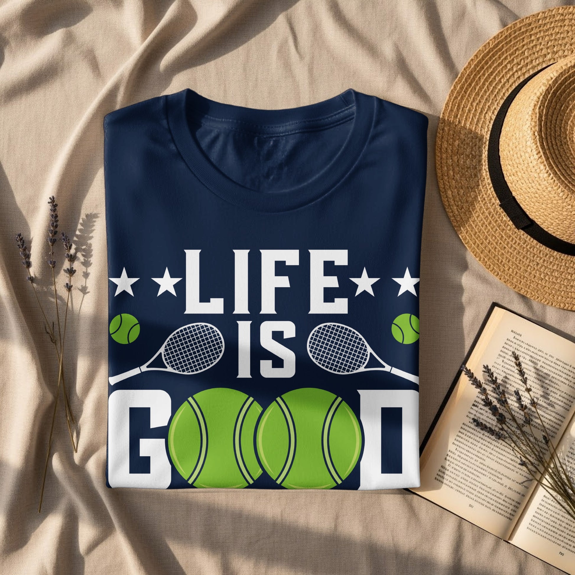 Navy blue t-shirt with white "LIFE IS GOOD" text and tennis imagery.