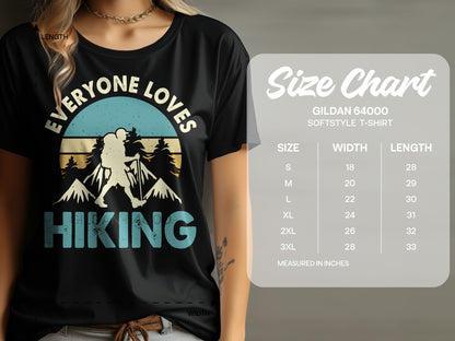 T-shirt with "Everyone Loves Hiking" graphic and size chart.