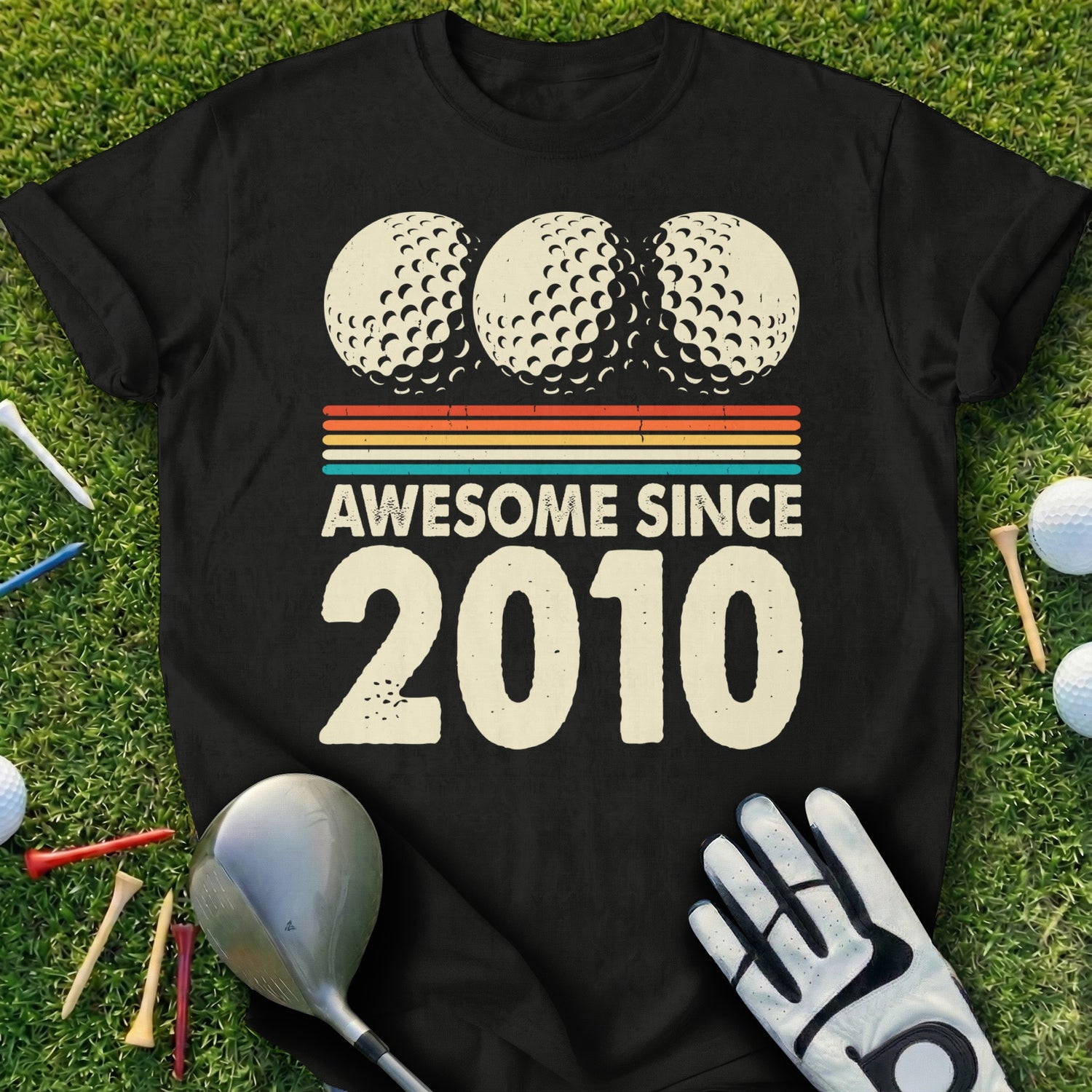 Black t-shirt with three golf balls and "Awesome Since 2010" text.