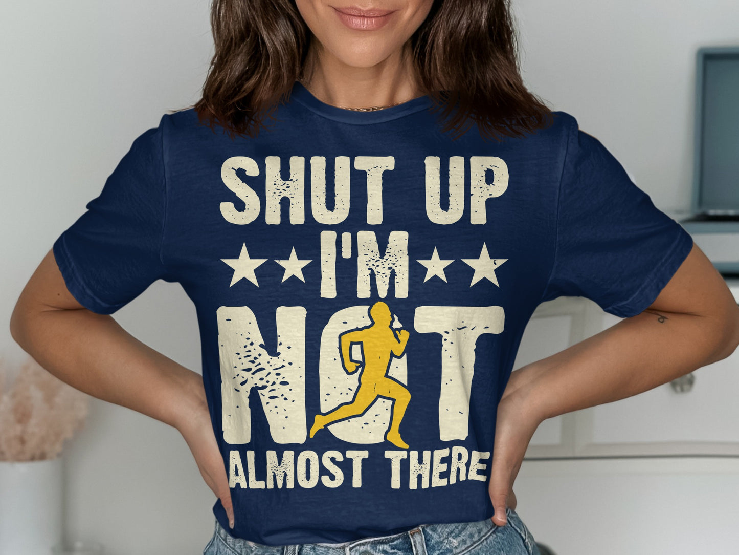 Navy t-shirt with "SHUT UP I'M ALMOST THERE" and running graphic.
