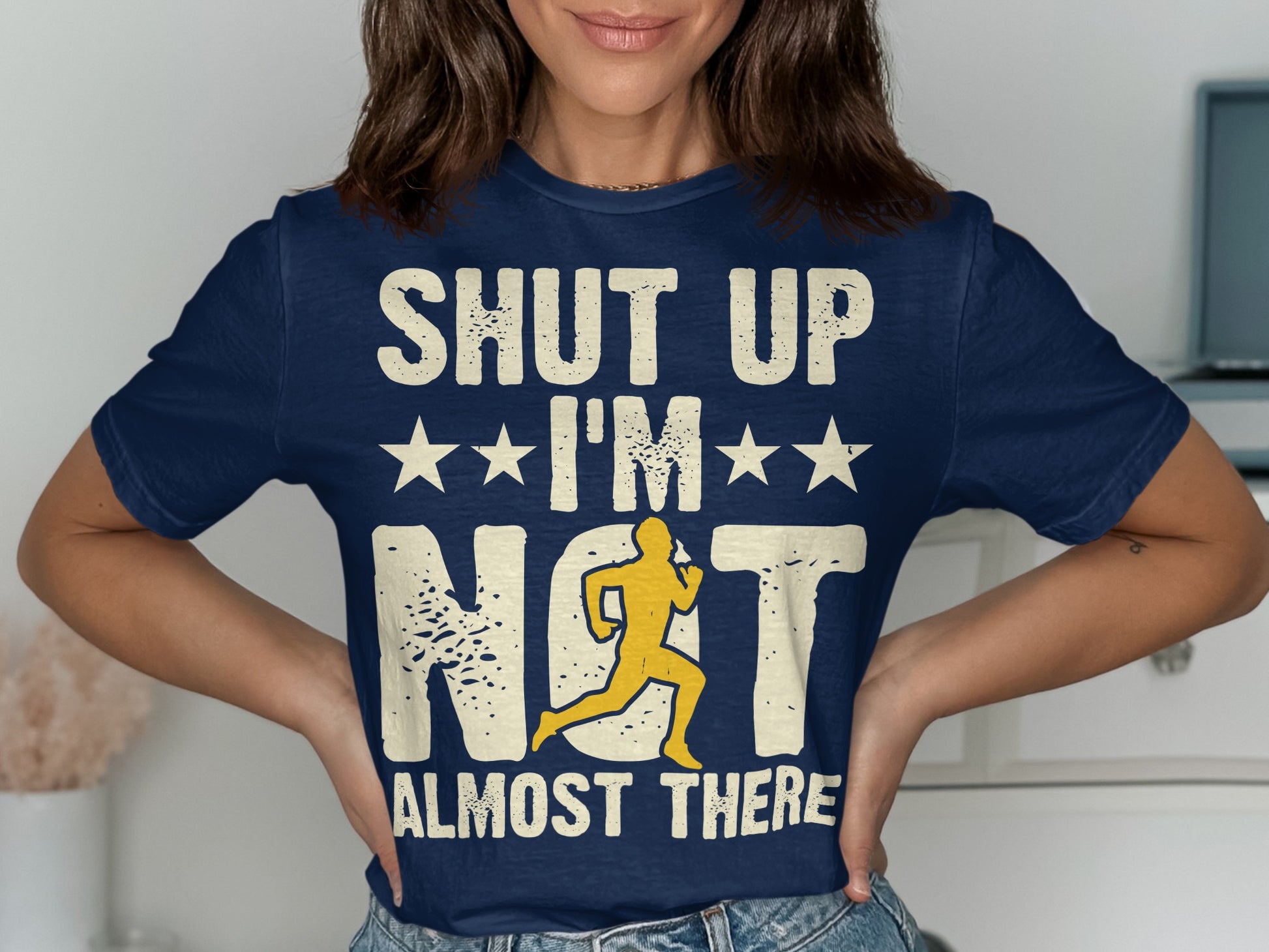Navy t-shirt with "SHUT UP I'M ALMOST THERE" and running graphic.