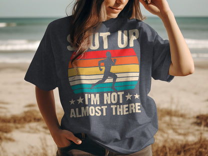T-shirt with runner graphic and text "Shut Up I'm Not Almost There."