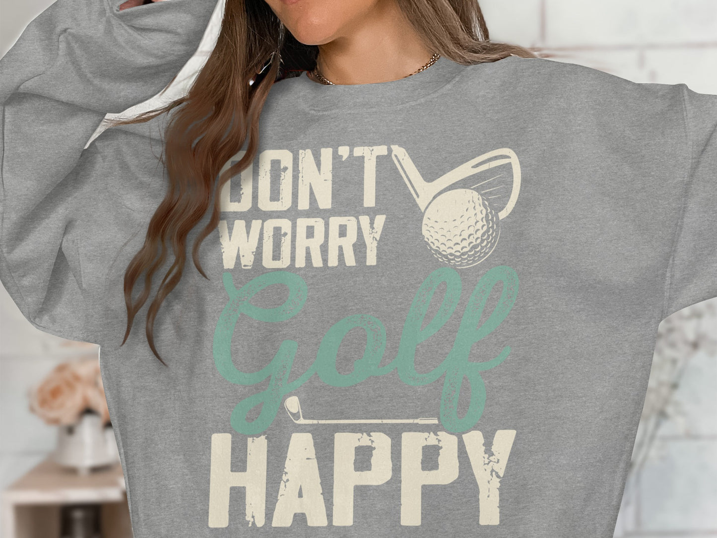 Grey sweatshirt with "DON'T WORRY GOLF HAPPY" graphic and golf club and ball.