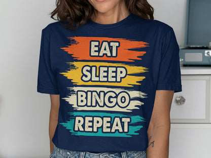 Navy t-shirt with "EAT SLEEP BINGO REPEAT" in colorful brush strokes.