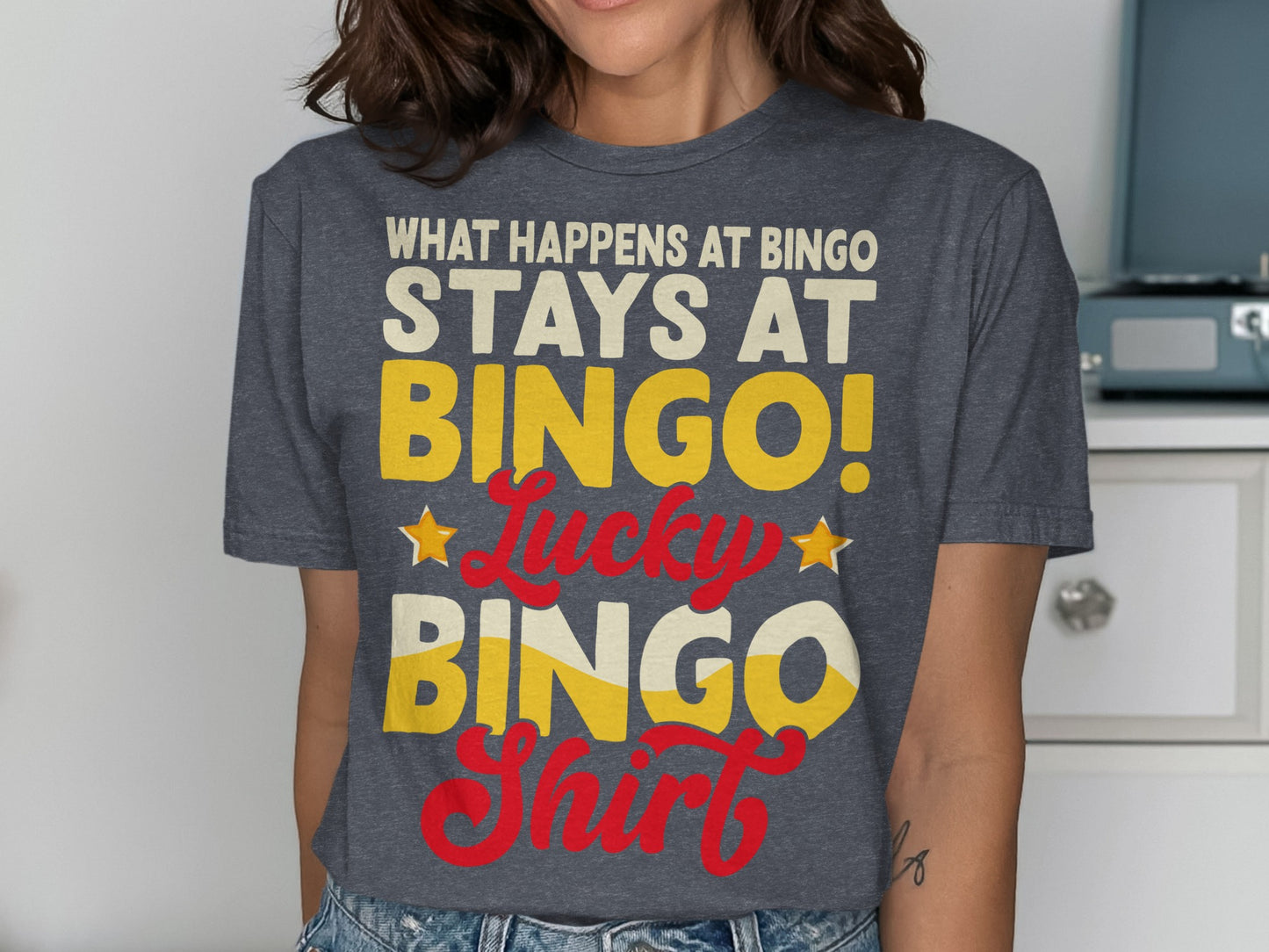 T-shirt with "What Happens at Bingo Stays at Bingo! Lucky Bingo Shirt" text.