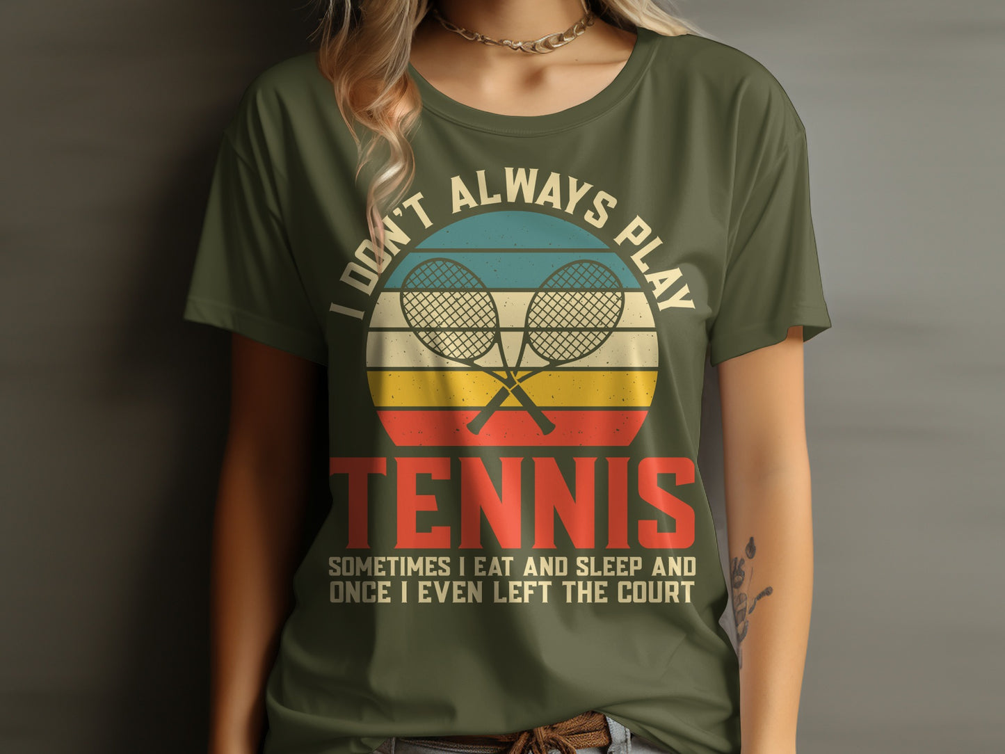 Olive green t-shirt with vintage tennis rackets and the text "Don't always play tennis. Sometimes I eat and sleep and once I even left the court."