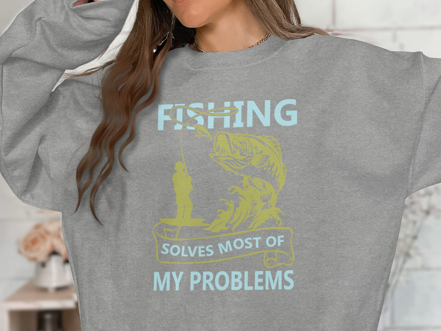 Gray sweatshirt with fishing graphic and text.