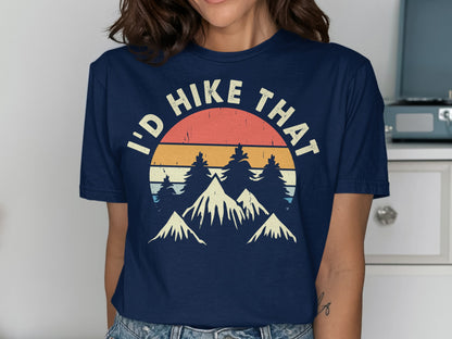 Navy t-shirt with "I'd Hike That" text over a mountain and sunset graphic.