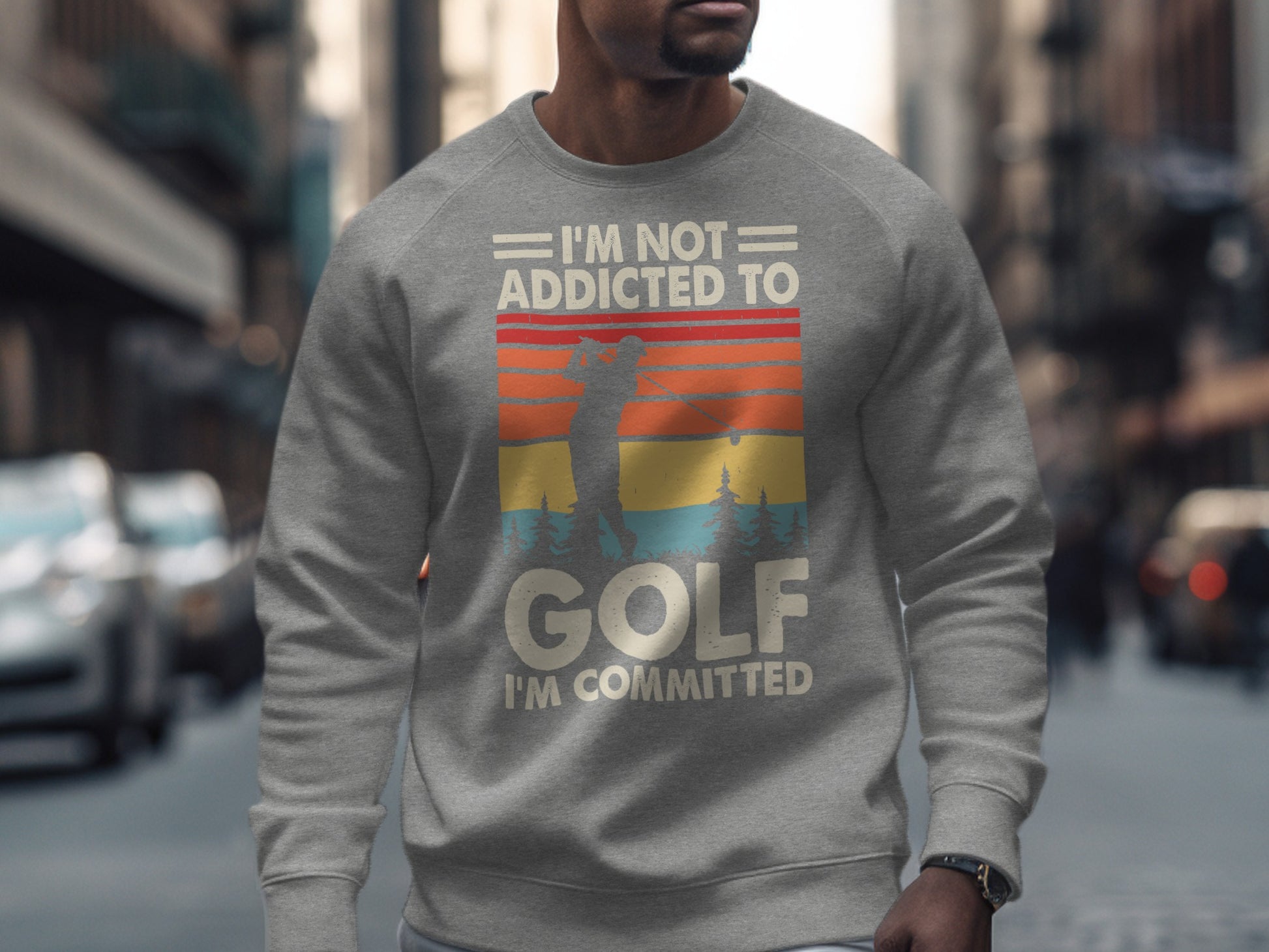 Gray sweatshirt with "I'm Not Addicted To Golf I'm Committed" and a sunset golf scene.