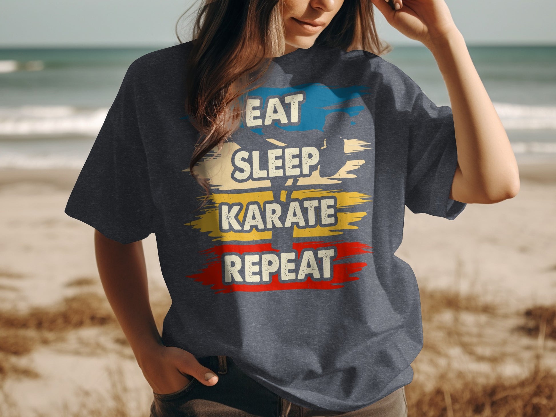 Dark grey t-shirt with "Eat Sleep Karate Repeat" in colorful brushstroke text.