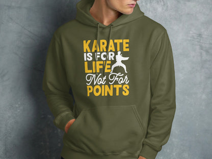 Olive green hoodie with "KARATE IS FOR LIFE NOT FOR POINTS" text and karate silhouette.