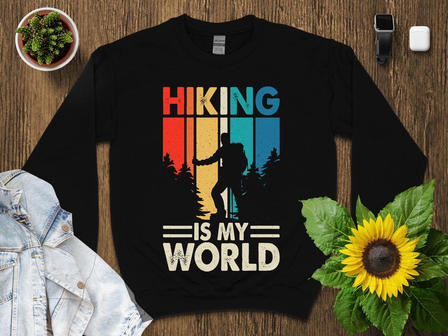 Black sweatshirt with "Hiking is my world" in retro style with hiker silhouette.